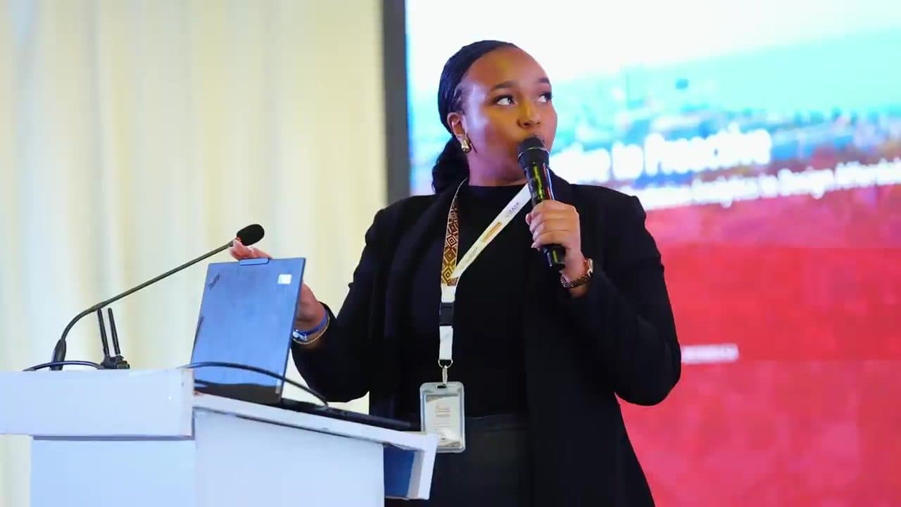 A speaker presenting from the podium